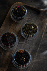 Tea varieties on wooden background