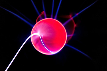 ball with electric neon pulses on a dark background, blur, selective focus