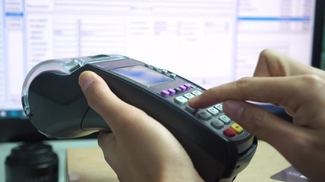 People using Credit card payment for purchase or sell products and service, business hand pushing button or swipe to buy shopping through electronic transaction machine in retail at store counter