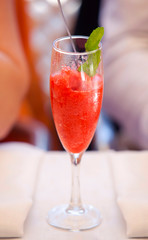 red cocktail with strawberry