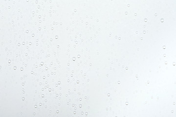 Water drops on white surface background.