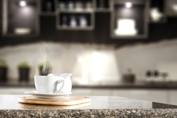 Desk of free space for your decoration and blurred kitchen interior 