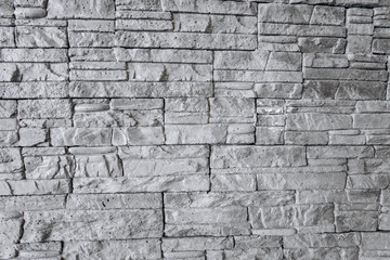 The texture of the brick wall is gray. Brick background