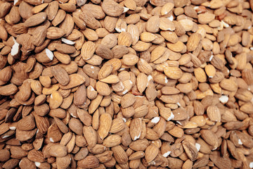 Background make from salt pistachios in a shell. A lot of pistachio nuts