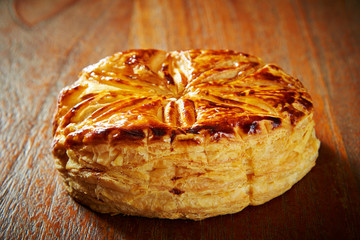 Sweet danish pie on wooden background 