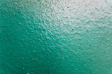 The old paint on the wood. The texture of the paint