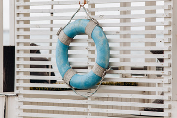Old blue lifeline on the basis of rescuers. Lifeline to the sea.