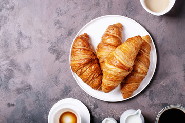 Fresh coffee with croissant