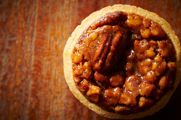 Pecan nuts tart on wooden background 