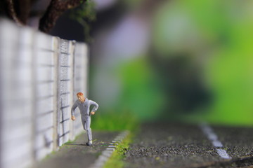 Illustration Photo, Cheap and Easy Sport in the morning, Alone Mini Figure Sport Man Toy at Asphalt...