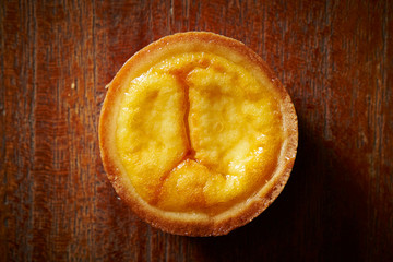 Cheese tart on wooden background