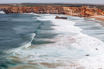 Beautiful view of the sea waves from the rocks in algarve, Portugal