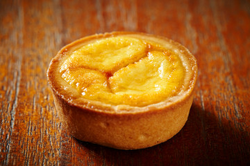Cheese tart on wooden background