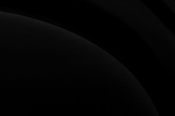 Black gray satin dark fabric texture luxurious shiny that is abstract silk cloth background with patterns soft waves blur beautiful.