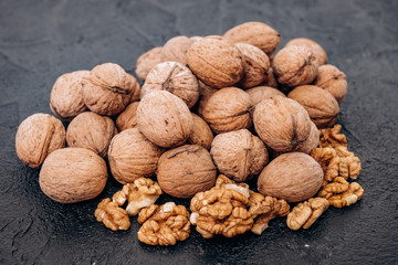 Walnuts on black background are ready to eat.