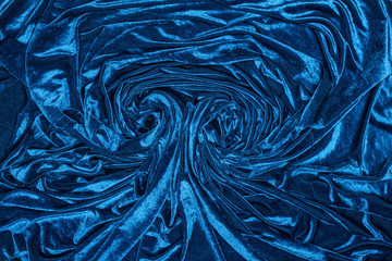 Top view of background of wavy blue velvet cloth