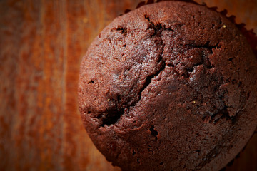 Chocolate cupcake on wooden background 