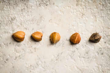 Raw buckwheat on the kitchen table. Selective focus. shallow depth of field.