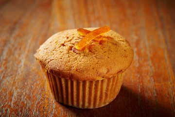 Orange peel cupcake on wooden background 