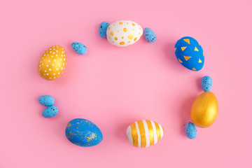eggs golden and blue on modern beautiful pink paper