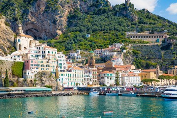 Beautiful Amalfi on hills leading down to coast, comfortable beaches and azure sea in Campania,...