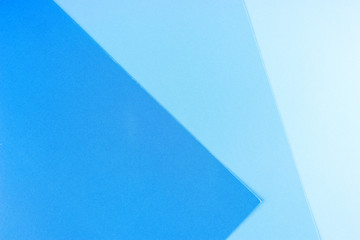 Blue background. Three separate shades of the blue