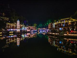 Naklejka premium Scenery view in the night of fenghuang old town .phoenix ancient town or Fenghuang County is a county of Hunan Province, China