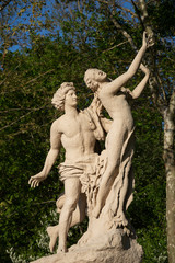 Coercing, women sexual abuse concepts. Chastity and sexual desire. Apollo and Daphne park sculpture. 