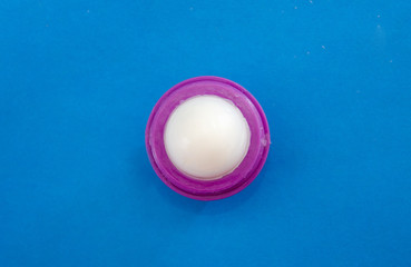 Hygienic, lipstick on a blue background.