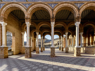 Fototapeta na wymiar Beautiful arcades on the central square of Seville Plaza de Espana, Andalucia, Spain