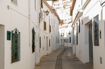 White houses in Spanish town. Urban background.