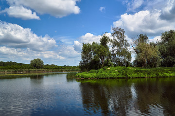 Landscape with lake and forest on a summer day in Poland.