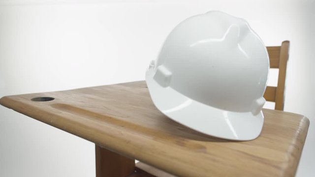 Training In The Trades - Hard Hat On A Classroom Desk