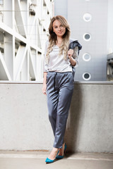 Young beautiful woman posing outdoors