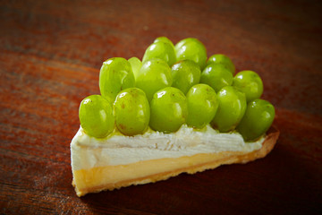 Muscat grape tart on wooden background 