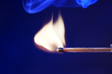 Lit matches and blown out in the studio photographed with colorful foils before the flashes