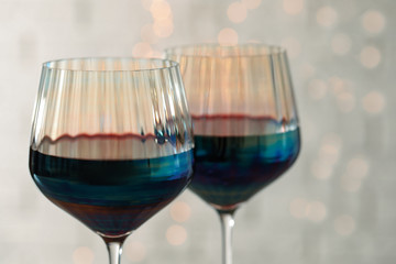 Glasses of red wine on light background, closeup