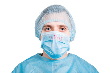 Portrait of handsome man wearing medical uniform and mask with virus word isolated on white background. Protect your health. Coronavirus concept