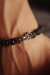 close-up bracelet on a guy’s hand