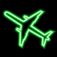 Green neon sign of airplane on black background