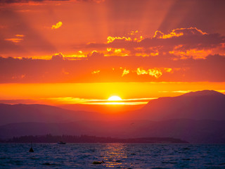 Lago di Garda in northern Italy, family tourism boats, crystal clear water, summer holidays vacations