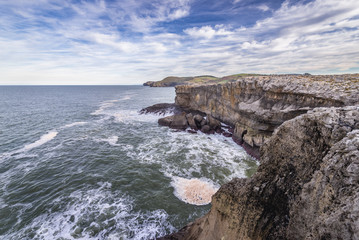 Fototapeta na wymiar Rugged shore of Ajo cape over Bay of Biscay of the northeast Atlantic Ocean in Cantabria, Spain