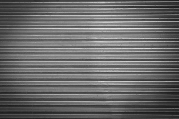 Fototapeta premium Metal texture pattern, ribbed cast iron surface, textured black background , wall for dark backdrop , loft style interior.