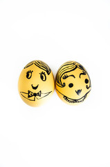 Faces of men and women drawn on chicken eggs. Gender equality, neutrality. Man and woman dominate,...