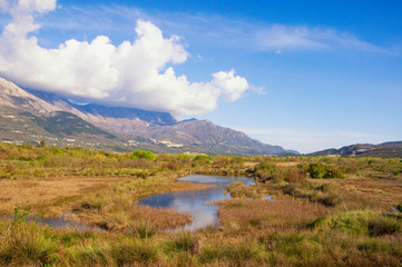 Fototapeta na wymiar Beautiful wetland landscape. Montenegro, Tivat. View of Tivat Salina ( Tivatska Solila ) on sunny spring day