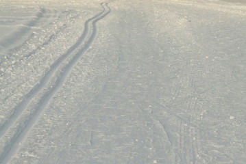 Ski track in snow , active winter holiday concept.