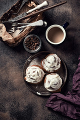 Synabones with vanilla cream, a cup of coffee and jar of coffee beans