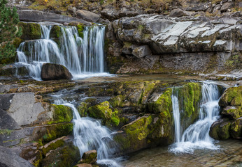Fototapeta na wymiar View of the Soaso waterfalls, on the Arazas river, located in the Ordesa y Monte Perdido national park, in the province of Huesca (Spain), in the Pyrenees mountains.