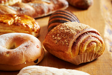 Various bread on wooden table 