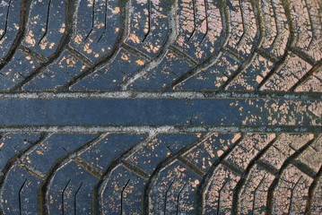 plastic texture from black old dirty tire with brown paint